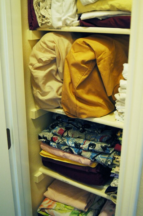 Stuffed Linen Closet - Organized Shelves in Linen Closet