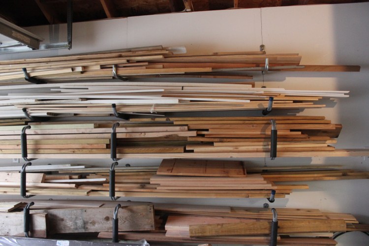 Making A Workshop Work - organized wood on the wall